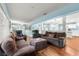 Inviting living room features ample seating and a view of the kitchen area at 8710 Sw 91St Pl # E, Ocala, FL 34481