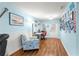 The office features wood-style flooring, a work station, and plenty of natural light at 8710 Sw 91St Pl # E, Ocala, FL 34481