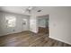 Bonus room features wood floors, a ceiling fan, windows, and access to the backyard at 9025 Sw 94Th Ln # C, Ocala, FL 34481