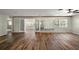 Bright living room featuring beautiful wood floors and natural light streaming through the window at 9025 Sw 94Th Ln # C, Ocala, FL 34481