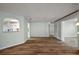 Living room featuring wood floors, updated walls, which leads to other areas of the home at 9025 Sw 94Th Ln # C, Ocala, FL 34481