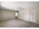 Spacious living room with plush carpeting, neutral walls, ceiling fan and abundant closet space at 9025 Sw 94Th Ln # C, Ocala, FL 34481