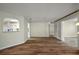 Living room with attractive wood floors and an open view to the kitchen area at 9025 Sw 94Th Ln # C, Ocala, FL 34481