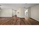 Open-concept living area featuring attractive wood flooring throughout the space at 9025 Sw 94Th Ln # C, Ocala, FL 34481