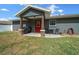 Cozy back patio features outdoor seating and grill, perfect for entertaining and relaxation at 9436 Se 163Rd St, Summerfield, FL 34491