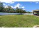 Fenced backyard with mature trees and landscaping offers a private outdoor space at 9436 Se 163Rd St, Summerfield, FL 34491