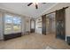 Welcoming entryway with sliding barn doors, tiled floors, and abundant natural light at 9436 Se 163Rd St, Summerfield, FL 34491