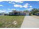 Well-maintained home with a long driveway, landscaping, and an inviting front entrance at 9436 Se 163Rd St, Summerfield, FL 34491