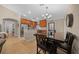 Spacious open-concept kitchen featuring custom cabinets, granite countertops, stainless steel appliances, and tile flooring at 9436 Se 163Rd St, Summerfield, FL 34491