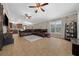 Spacious living room features tile flooring, ceiling fans, and ample natural light at 9436 Se 163Rd St, Summerfield, FL 34491
