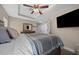 Comfortable main bedroom with a decorative ceiling fan, and wood look floors at 9436 Se 163Rd St, Summerfield, FL 34491