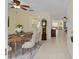 Elegant dining room featuring a wooden table and seamless tile flooring at 9575 Sw 92Nd Street Rd, Ocala, FL 34481