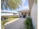 Inviting covered front porch with mature landscaping, seating, and grill at 9575 Sw 92Nd Street Rd, Ocala, FL 34481