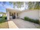 Inviting front porch features neutral stucco and a dark colored grill at 9575 Sw 92Nd Street Rd, Ocala, FL 34481