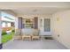 Inviting front porch featuring rocking chairs and a quaint welcome area at 9575 Sw 92Nd Street Rd, Ocala, FL 34481