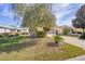 Charming single-story home with a well-maintained lawn, mature trees, and a long driveway at 9575 Sw 92Nd Street Rd, Ocala, FL 34481