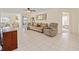 Neutral living room with tiled floor, sofa and recliner at 9575 Sw 92Nd Street Rd, Ocala, FL 34481