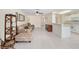 Inviting living room with neutral tones, tile flooring and an open layout to the kitchen, perfect for entertaining at 9575 Sw 92Nd Street Rd, Ocala, FL 34481