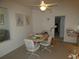 Casual dining area with a table and chairs, adjacent to the kitchen and living spaces at 9610 Sw 198Th Cir, Dunnellon, FL 34432