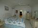 Comfortable main bedroom with ceiling fan, carpet, and neutral tones at 9610 Sw 198Th Cir, Dunnellon, FL 34432