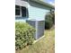Franklin brand outdoor air conditioner unit surrounded by green bushes at 11792 Sw 137Th Loop, Dunnellon, FL 34432