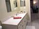 Bathroom featuring a vanity with a countertop and white cabinets for storage at 11792 Sw 137Th Loop, Dunnellon, FL 34432