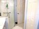 Modern bathroom includes a glass-enclosed shower, tile flooring, and stylish vanity at 11792 Sw 137Th Loop, Dunnellon, FL 34432