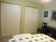 Comfortable bedroom featuring closet with sliding doors and carpeted floor at 11792 Sw 137Th Loop, Dunnellon, FL 34432