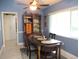 Bright dining area with large window, furniture, and decor with a built-in hutch at 11792 Sw 137Th Loop, Dunnellon, FL 34432