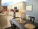Dining area showcasing table with seating adjacent to an updated kitchen at 11792 Sw 137Th Loop, Dunnellon, FL 34432