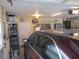 Well-lit garage interior with organized storage, shelving, and ample space for parking at 11792 Sw 137Th Loop, Dunnellon, FL 34432