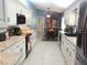 This kitchen features white cabinets, stainless steel appliances and an eat-in kitchen space at 11792 Sw 137Th Loop, Dunnellon, FL 34432