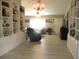 Spacious living room with custom built-in shelving and bright natural light at 11792 Sw 137Th Loop, Dunnellon, FL 34432