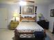 This main bedroom offers a ceiling fan and a full furniture set at 11792 Sw 137Th Loop, Dunnellon, FL 34432