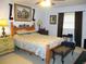 This main bedroom offers a ceiling fan and a full furniture set at 11792 Sw 137Th Loop, Dunnellon, FL 34432