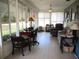 Bright sunroom with tile floors and lots of windows at 11792 Sw 137Th Loop, Dunnellon, FL 34432