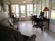 Sunroom with tile floors and view to backyard at 11792 Sw 137Th Loop, Dunnellon, FL 34432