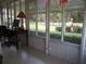 Sunroom with tile floors and backyard view at 11792 Sw 137Th Loop, Dunnellon, FL 34432