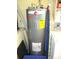 Classic Rheem water heater with energy guide and safety information in the laundry room at 11792 Sw 137Th Loop, Dunnellon, FL 34432