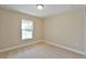 Carpeted bedroom with natural light from the window at 12805 Sw 38Th Cir, Ocala, FL 34473