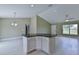 Open floorplan showcases a kitchen island and lots of bright light at 12805 Sw 38Th Cir, Ocala, FL 34473