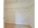 Walk-in closet featuring wire rack shelving and carpet flooring at 12805 Sw 38Th Cir, Ocala, FL 34473