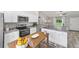Charming kitchen with stainless steel appliances, granite countertops, and breakfast nook at 13105 Sw 77Th Ct, Ocala, FL 34473