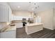 Modern kitchen featuring white cabinets, an island, and stainless steel appliances at 13180 Sw 80Th St, Dunnellon, FL 34432