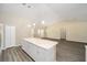 Spacious kitchen with a large center island and modern stainless steel appliances at 13180 Sw 80Th St, Dunnellon, FL 34432