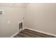 Bright laundry room features hardwood floors, utility sink and washer hookup at 13180 Sw 80Th St, Dunnellon, FL 34432