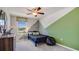 Cozy bedroom featuring unique geometric painted wall, ceiling fan, and natural lighting at 2163 Ne 28Th Ln, Ocala, FL 34470
