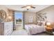 Charming bedroom with stylish furniture, decorative accents, and natural light from the window at 2163 Ne 28Th Ln, Ocala, FL 34470