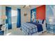 Bedroom decorated with a soccer theme, featuring blue accents, large window, and ceiling fan at 2940 Ne 21St Terrace Rd, Ocala, FL 34470