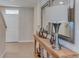 Stylish entryway features a console table with decorative accents, mirrors and a view of the front door at 2940 Ne 21St Terrace Rd, Ocala, FL 34470